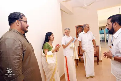 a group of people standing in a room at Wariyam Heritage in Trichūr