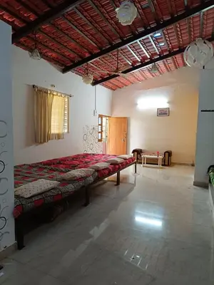 a bedroom with a large bed in a room at Lilly Farm in Halgūr