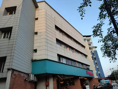 a building on a city street with a building at Sri bhavan residency in Palakkad