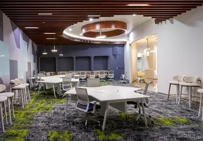 a group of tables and chairs in a room at 0484 Aero Lounge-Terminal 2 Cochin Airport Hotel in Nedumbassery