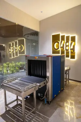 a room with a table in front of a store at 0484 Aero Lounge-Terminal 2 Cochin Airport Hotel in Nedumbassery