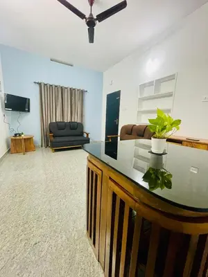 a living room with a counter with a plant on it at D Villas in Kunnamangalam