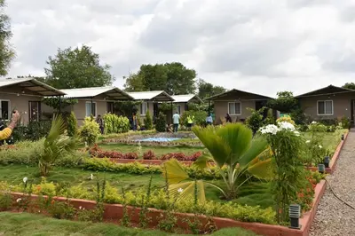 a garden at a resort with flowers and plants at Valley Vibes in Rāmanagaram