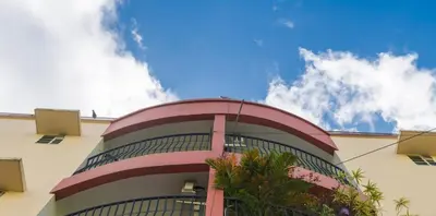 a tall building with a blue sky in the background at Sancta Maria Airport Suites in Nedumbassery