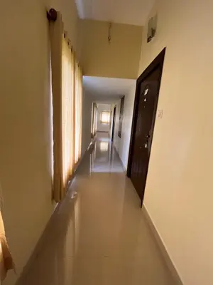 an empty hallway with a door and a hallwayngth at River View Apartments a Pet Friendly Retreat in Ernakulam