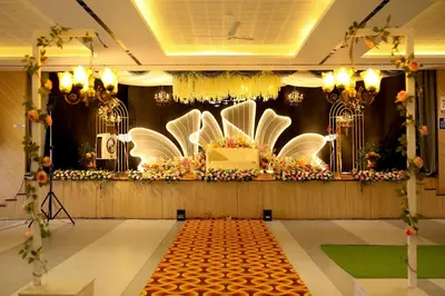 a room with a stage with a bunch of flowers at Jayalakshmi Residency in Vaduvanchal