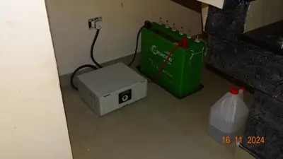 a green box sitting next to a green bag and a box at Nirmalyam Homestay in Kuttippuram