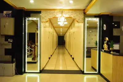 a hallway of a store with mirrors and a long corridor at Rajalakshmi Comforts Mysuru in Mysore
