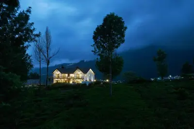 a house sitting in a field at night at Shangrila Casa-Premium Homestay in Wellington Town