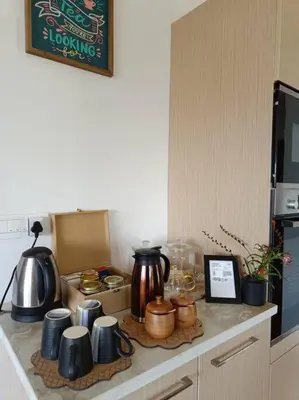 a kitchen counter with pots and pans on a stove at Shangrila Casa-Premium Homestay in Wellington Town