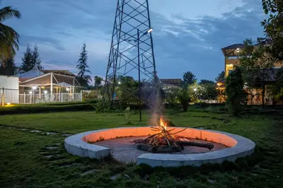 a fire pit in the middle of a yard at Encanto Farmstay Resort in Mysore