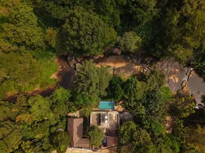 an overhead view of a house in the forest at Hunters Hideout Resort in Wayanad