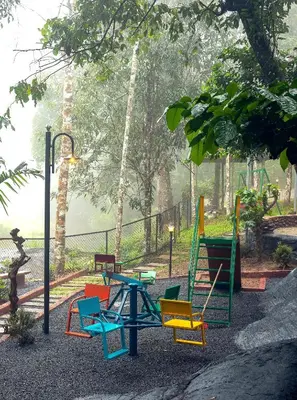a group of colorful chairs sitting around a table at Hunters Hideout Resort in Wayanad