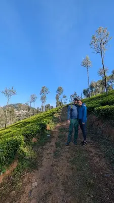 two men are standing on a dirt road at VALLEY VIEW INN, Kotagiri in Kotagiri