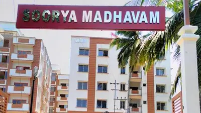 a sign for a hotel in front of a building at CC Family in Guruvāyūr