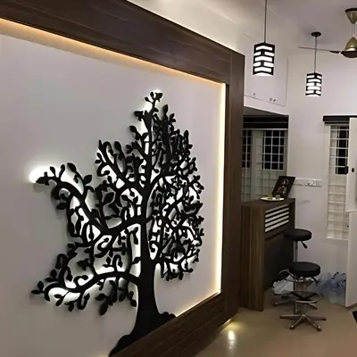 a tree mural on a wall in a room at Palatty's Resorts in Athirappally