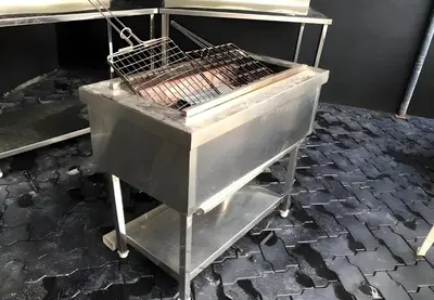a metal cart sitting on top of a brick floor at Palatty's Resorts in Athirappally