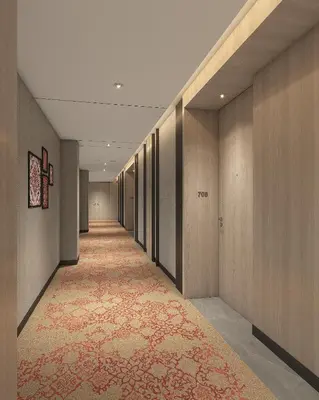 a hallway with a carpet and wooden walls and a long corridor at Taj Cochin International Airport, Kerala in Cochin