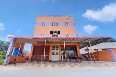 a building with a sign in front of it at Super Hotel O Viswapuram in Coimbatore
