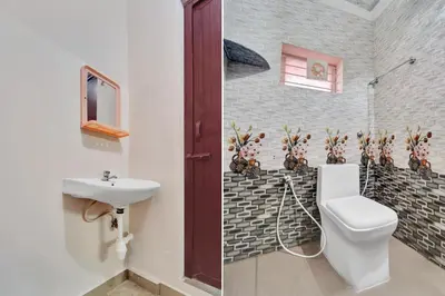 a bathroom with a toilet and a sink at Super Hotel O Viswapuram in Coimbatore