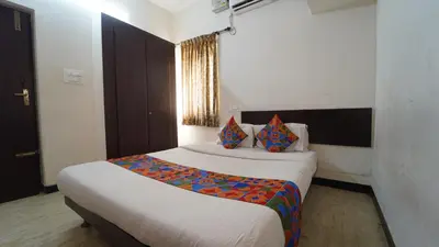 a bedroom with a large bed in a room at Codissia In Nini Residency in Coimbatore