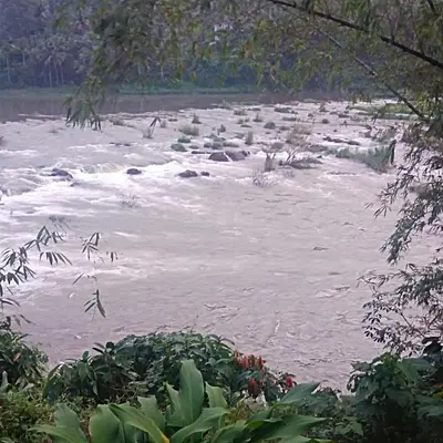 a river with rapids on top of it at Holy Village Homestay in Neriyamangalam