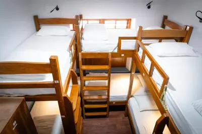 a group of four bunk beds in a room at Leo Vishroam in Mysore
