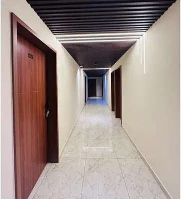 a corridor of an office with a door and a hallway at Sara Archid in Kommeri
