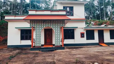 a building with an entrance to a house at JoeAnn Villa in Kalpetta