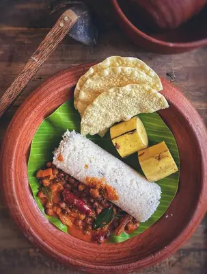 a plate of food with bread and beans and cheese at JoeAnn Villa in Kalpetta