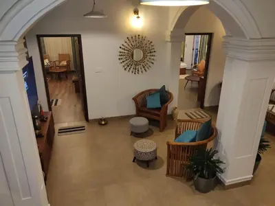 an overhead view of a lobby with chairs and tables at The Elegant homes in Kushālnagar