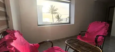 two chairs in a room with a window at Sea Breeze Cherai Homestay in Pallipuram