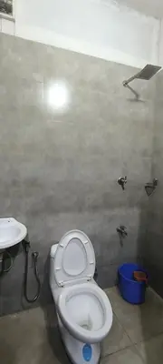 a bathroom with a toilet and a sink at Sea Breeze Cherai Homestay in Pallipuram