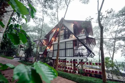 a tree house in the forest at Wayanad Vista Palm View Homes in Padinjarathara