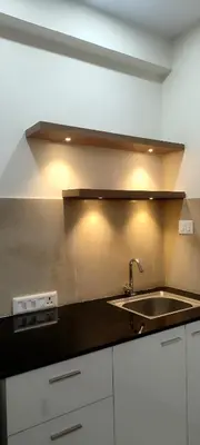 a kitchen with a sink and a counter top at Sree Nandhanam Apartment's in Guruvāyūr