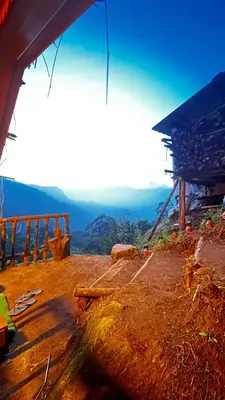 a view of a building with a view of a mountain at Alpine Mud house Kanthalloor in Kanthalloor