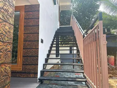 a set of stairs leading up to a house at Chakkantharas Premium Villa in Athirappilly