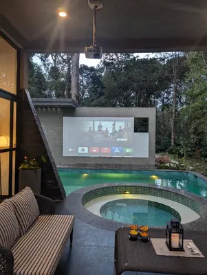 a swimming pool with a tv in a house at Earthsong & Birdsong Luxury Pool Villa by Luxunlock Private Villas in Suntikoppa