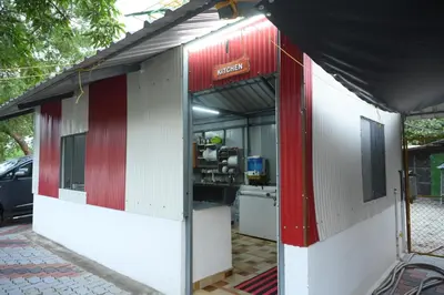 a building with red and white stripes on it at Sidharth Resort, Vadavannur in Kollengode