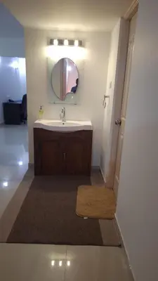 a bathroom with a sink and a mirror at Atlas Celestial Park in Nedumbassery