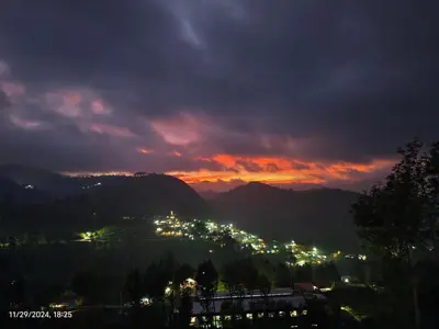 a view of a city lit up at night at May Fair Vista Luxury Villa - Huge Lawn - Scenic Views - Free Parking in Kotagiri