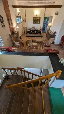 an aerial view of a living room with a large room at Yellow House Kotagiri in Kotagiri
