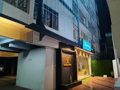a building with a door on the side of it at Hotel Beverly Plaza Kozhikode in Kozhikode