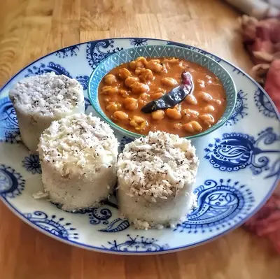 a plate of food with rice and beans on a table at Preserve Ooty in Ooty