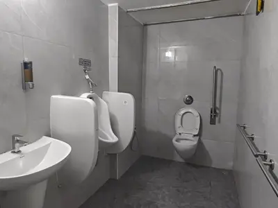 a bathroom with a sink and a toilet at 7 Elysee Homestay - Safire - Premium 3BHK Family Flat in Trichūr