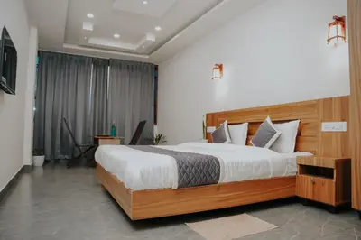 a bedroom with a large bed in a room at Saj Heritage in Kalpetta
