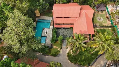 an overhead view of a house with a swimming pool at Athirapilly Ontherocks in Athirappilly