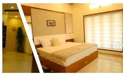 a bedroom with a bed in a room with a window at Welcome to SP Luxury Bed Villa in Kāladi