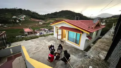 a group of people standing outside of a house at Chillz Heaven Resorts - Ketti Palada in Coonoor