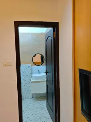 a bathroom with a sink and a mirror on the wall at GIRASSOL the hill villa in Vythiri